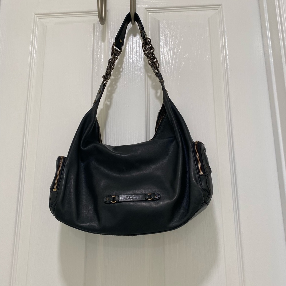 Cole Haan vintage bag used good condition leather slightly faded i small area.
